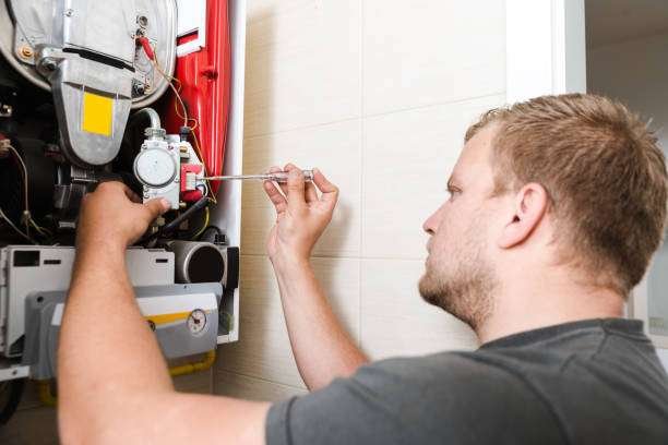 Technician repairing Gas Furnace