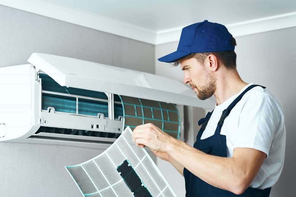 man-repair-cleaning-air-conditioner-worker-home